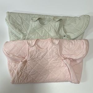 A bundle of two  pottery barn baby sleeveless sleep sacks